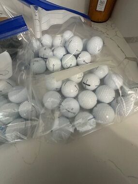 15 Quality TaylorMade White Golf Balls. No damage. 15 per bag.